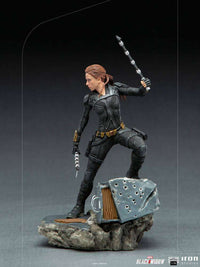 Iron Studios Black Widow 1/10 scale statue in a black tactical suit, holding batons on a detailed debris base.