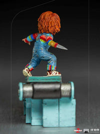 Rear view of the 15 cm Iron Studios Child's Play 2 Chucky statue, featuring his iconic overalls and a blade hand.