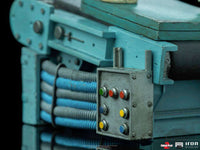 Close-up of the blue industrial machinery base for the Iron Studios Child's Play 2 Chucky 1/10 scale statue.