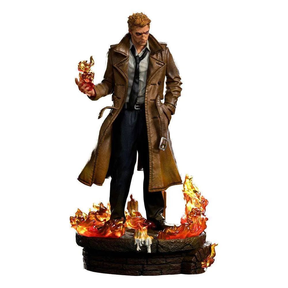 Iron Studios 1/10 Constantine statue featuring John Constantine in a trench coat standing on a fiery, candlelit base.