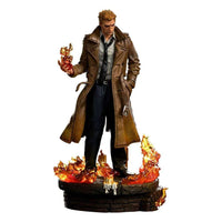 Iron Studios 1/10 Constantine statue featuring John Constantine in a trench coat standing on a fiery, candlelit base.