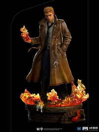 Iron Studios 1/10 Constantine statue featuring John Constantine in a brown trench coat with translucent fire effects.