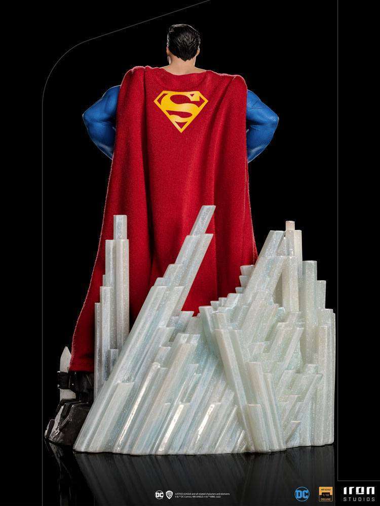 Back view of Iron Studios Superman Unleashed 1/10 scale statue with a red fabric cape and crystal base.