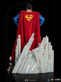 Back view of Iron Studios Superman Unleashed 1/10 scale statue with a red fabric cape and crystal base.