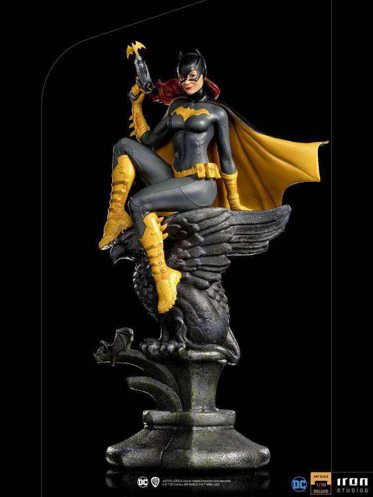 Iron Studios 1/10 Batgirl Deluxe Art Scale statue featuring the hero in a grey and yellow suit perched on a stone eagle.
