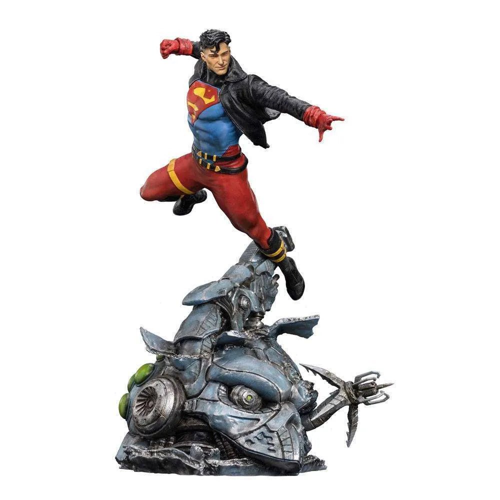 Iron Studios 1/10 Superboy statue in a dynamic flying pose, wearing a black leather jacket over his iconic suit.