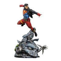 Iron Studios 1/10 Superboy statue in a dynamic flying pose, wearing a black leather jacket over his iconic suit.