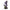 Iron Studios 1/10 The Joker statue in a purple suit holding a crowbar, standing on a detailed industrial base.