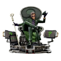 Iron Studios 1/10 The Riddler statue sitting on a throne with a question mark cane and screens on a detailed base.