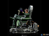 Side view of the 24cm Iron Studios The Riddler 1/10 scale statue sitting in a detailed mechanical chair.