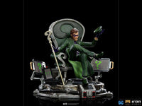 Iron Studios 1/10 The Riddler statue in a green suit sitting on a question mark throne with computer screens.