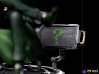 Close-up of the Iron Studios 1/10 The Riddler statue, featuring a textured screen with a green question mark symbol.