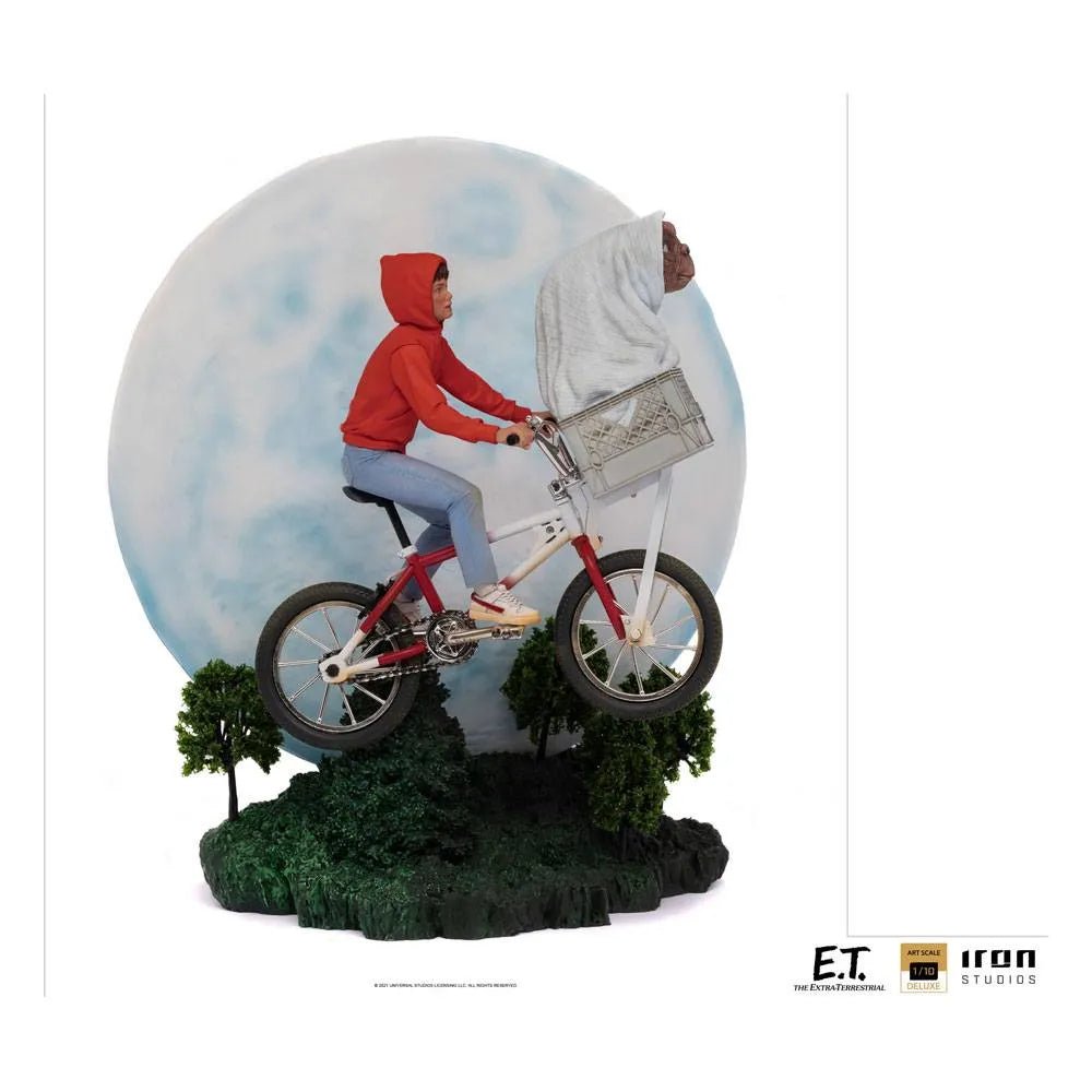 Iron Studios E.T. & Elliot 1/10 scale statue featuring Elliot riding a bicycle with E.T. in a basket before a full moon.
