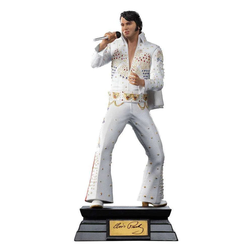 Iron Studios 1/10 scale Elvis Presley 1973 statue in a white jeweled jumpsuit holding a microphone on a display base.