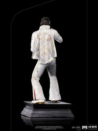 Back view of the Iron Studios 1/10 Elvis Presley 1973 statue in a white, jewel-studded jumpsuit on a black base.