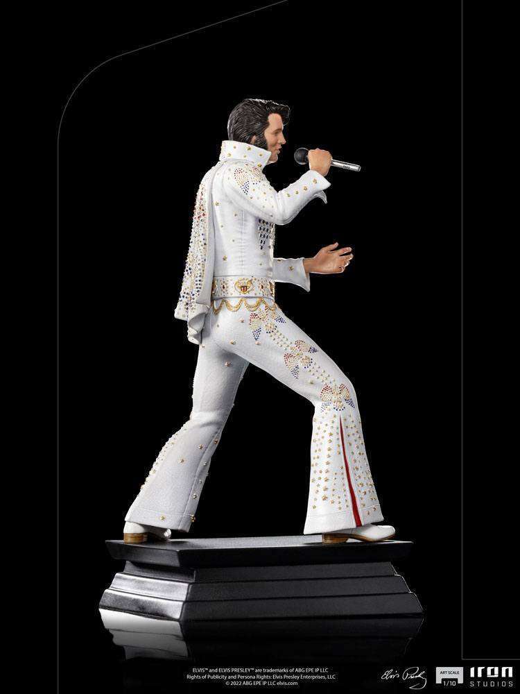 Side view of the Iron Studios 1/10 scale Elvis Presley 1973 statue in his iconic white jeweled jumpsuit and cape.