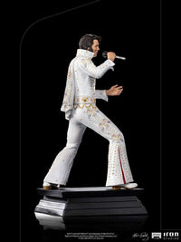 Side view of the Iron Studios 1/10 scale Elvis Presley 1973 statue in his iconic white jeweled jumpsuit and cape.