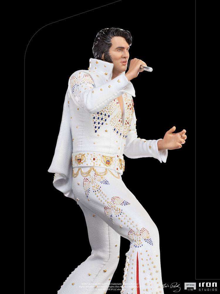 Iron Studios 1/10 scale Elvis Presley 1973 statue in a white jeweled jumpsuit, side view singing into a microphone.