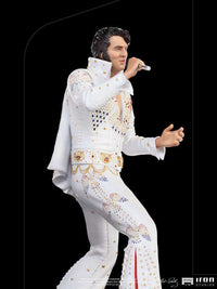 Iron Studios 1/10 scale Elvis Presley 1973 statue in a white jeweled jumpsuit, side view singing into a microphone.