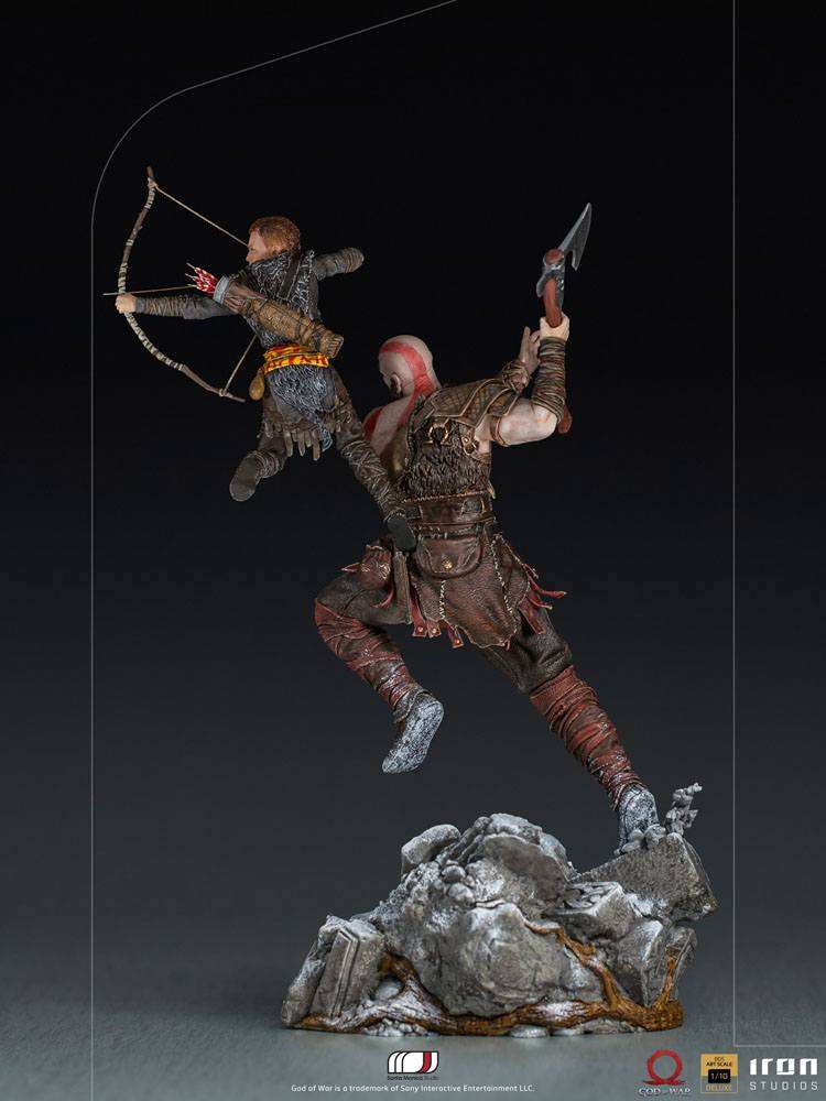 Rear view of Iron Studios 1/10 Kratos & Atreus statue, showing detailed armor and weapons on a rocky base.