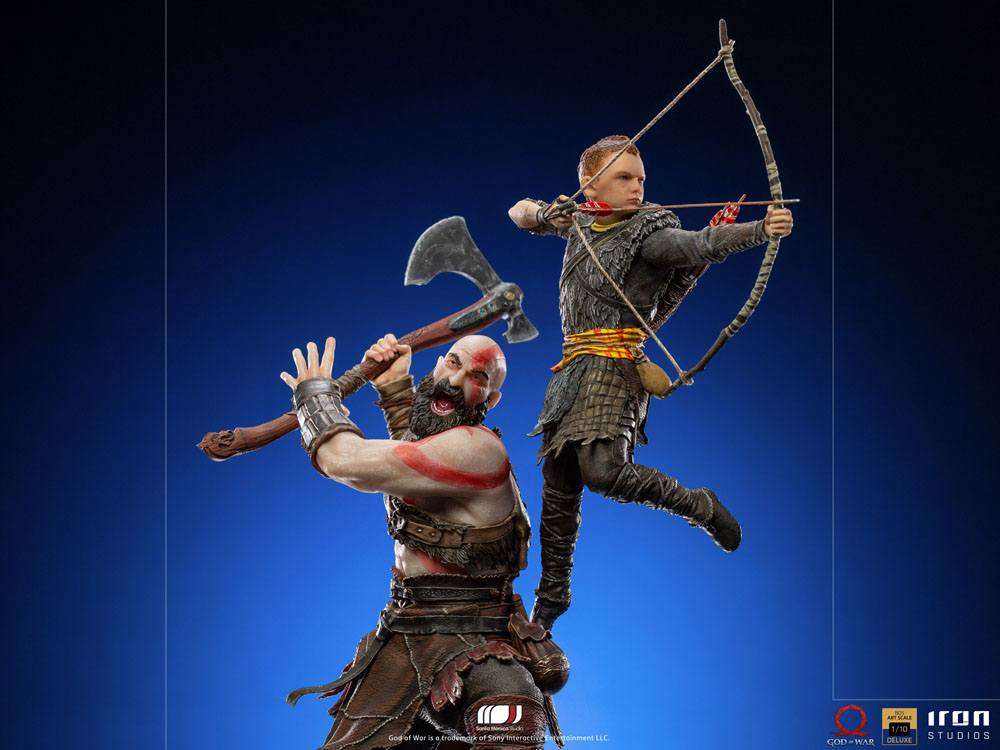Iron Studios 1/10 Kratos and Atreus statue showing Kratos wielding his axe while Atreus aims his bow in mid-air.