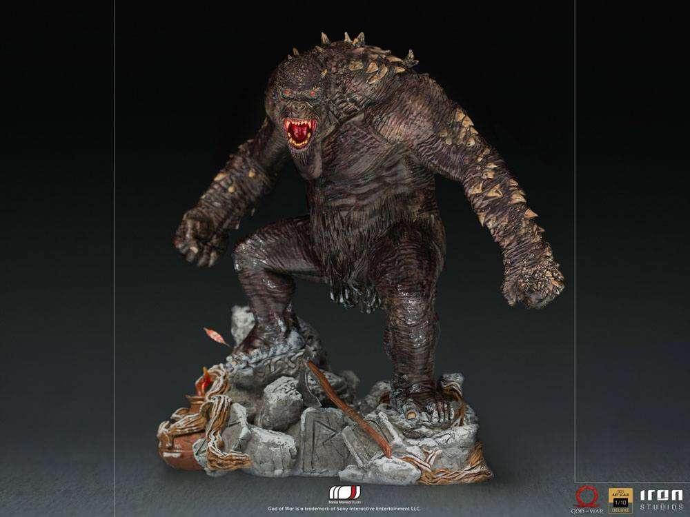 Iron Studios God of War 1/10 Ogre statue in a dynamic pose, featuring textured dark skin and a rocky, detailed base.