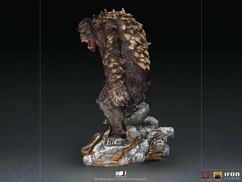 Side view of the 32 cm Iron Studios God of War Ogre statue featuring textured brown skin and rocky base details.