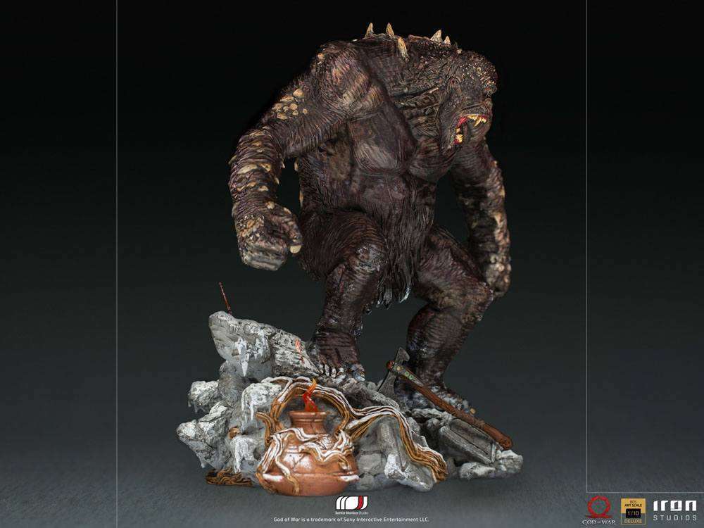 Side view of the 32 cm Iron Studios God of War Ogre 1/10 scale statue featuring a textured brown monster on a snowy base.