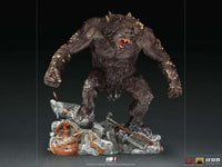 Iron Studios God of War Ogre 1/10 scale statue featuring a snarling, dark-furred beast on a detailed rocky base.