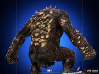 Back view of the Iron Studios God of War Ogre 1/10 scale statue featuring textured brown skin and rocky back spikes.