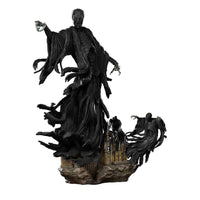 Iron Studios 1/10 Dementor statue featuring a dark, flowing figure hovering above a detailed Hogwarts castle base.