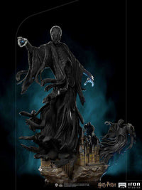 Iron Studios 1/10 Dementor statue featuring dark, flowing robes and glowing blue hands above a Hogwarts castle base.