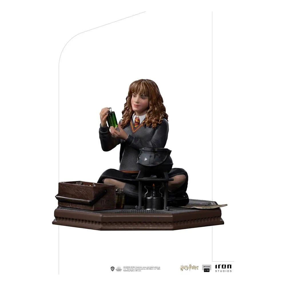 Iron Studios 1/10 Hermione Granger Polyjuice statue showing her sitting with a potion bottle and cauldron on a base.