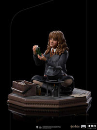 Iron Studios Hermione Granger Polyjuice 1/10 scale statue holding a green potion bottle on a detailed base.