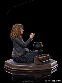 Side view of the Iron Studios Hermione Granger Polyjuice 1/10 scale statue with cauldron and potion kit on a base.