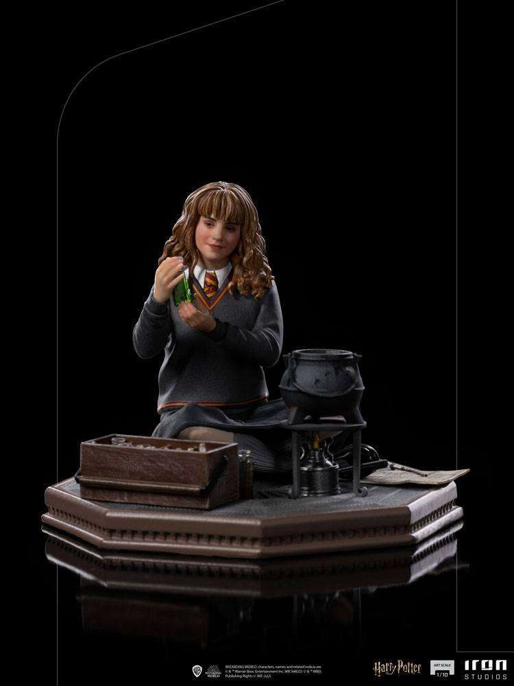Iron Studios 1/10 Hermione Granger Polyjuice statue showing her holding a potion vial by a cauldron on a display base.