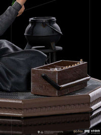 Close-up of Iron Studios Hermione Granger Polyjuice 1/10 statue showing a black cauldron and wooden potion kit on base.