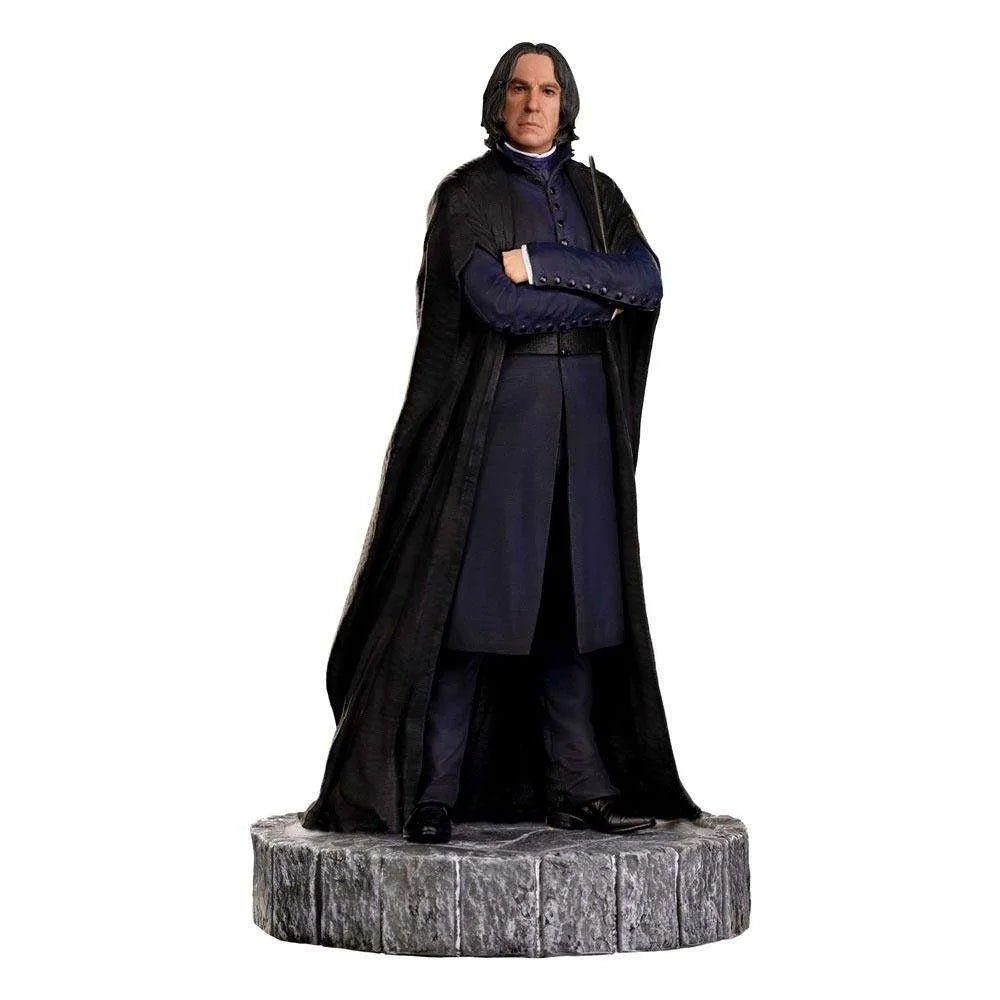Front view of Iron Studios 1/10 Severus Snape statue wearing a black cloak and blue coat on a stone-textured base.