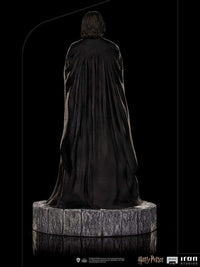 Back view of the 22 cm Iron Studios Severus Snape 1/10 scale statue featuring a flowing black cape on a stone base.