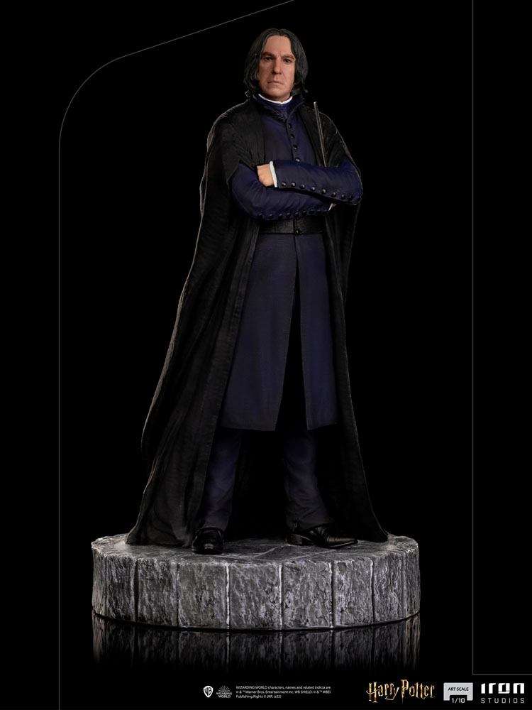 Iron Studios 1/10 Severus Snape statue in a black robe and blue coat, standing on a textured stone-style base.