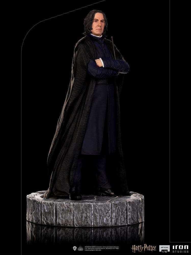 Iron Studios 1/10 scale Severus Snape statue in a black robe and coat, standing on a circular stone-textured base.