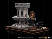 Iron Studios Hermione Granger Polyjuice 1/10 scale statue featuring Hermione by a stone fountain with a potion cauldron.