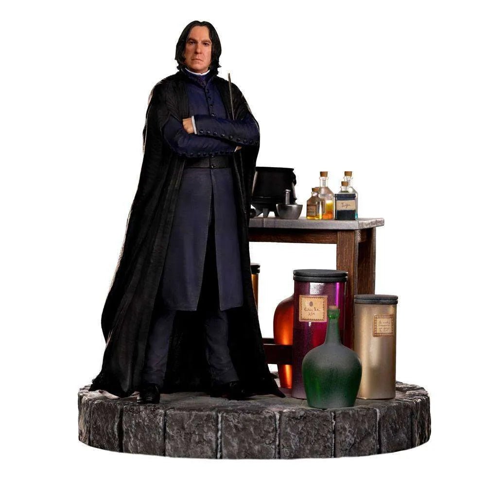 Iron Studios Severus Snape 1/10 scale statue featuring the professor in a black robe beside a potion-filled wooden desk.