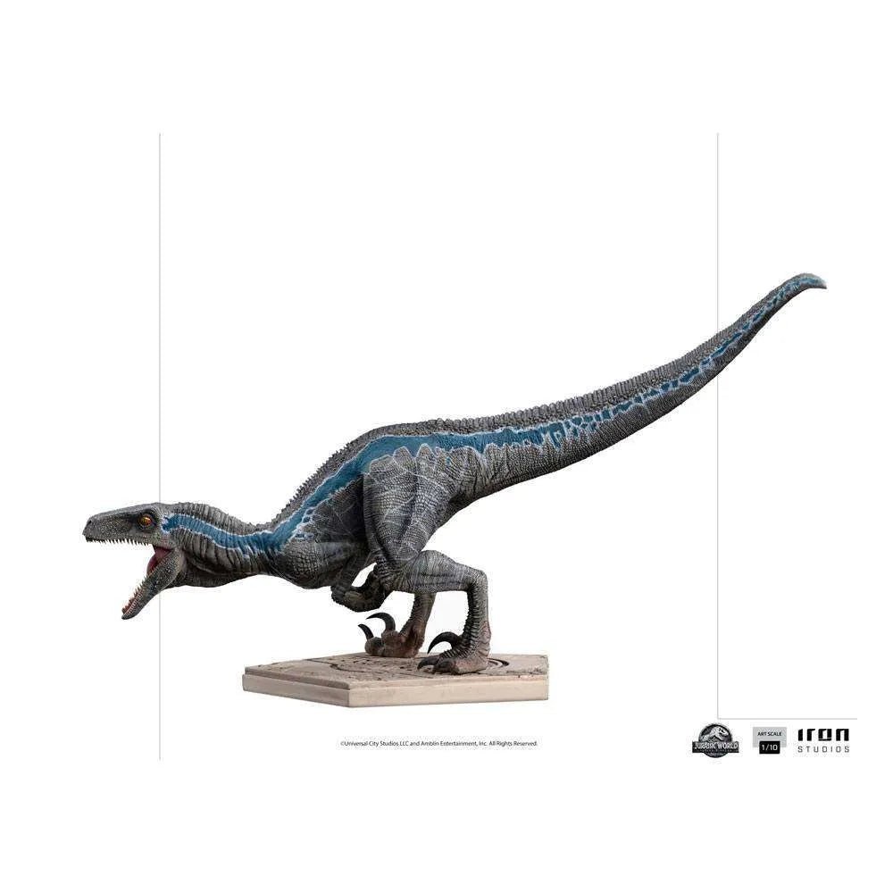 Side view of Iron Studios 1/10 Blue Jurassic World statue, featuring a textured grey raptor with a blue stripe.