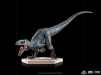 Side view of the 19 cm Iron Studios Blue statue from Jurassic World, featuring textured grey scales and a blue stripe.