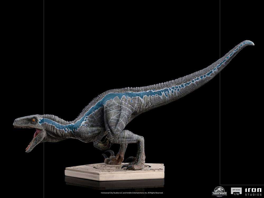Side view of Iron Studios 1/10 scale Blue dinosaur statue from Jurassic World with detailed gray and blue scales.