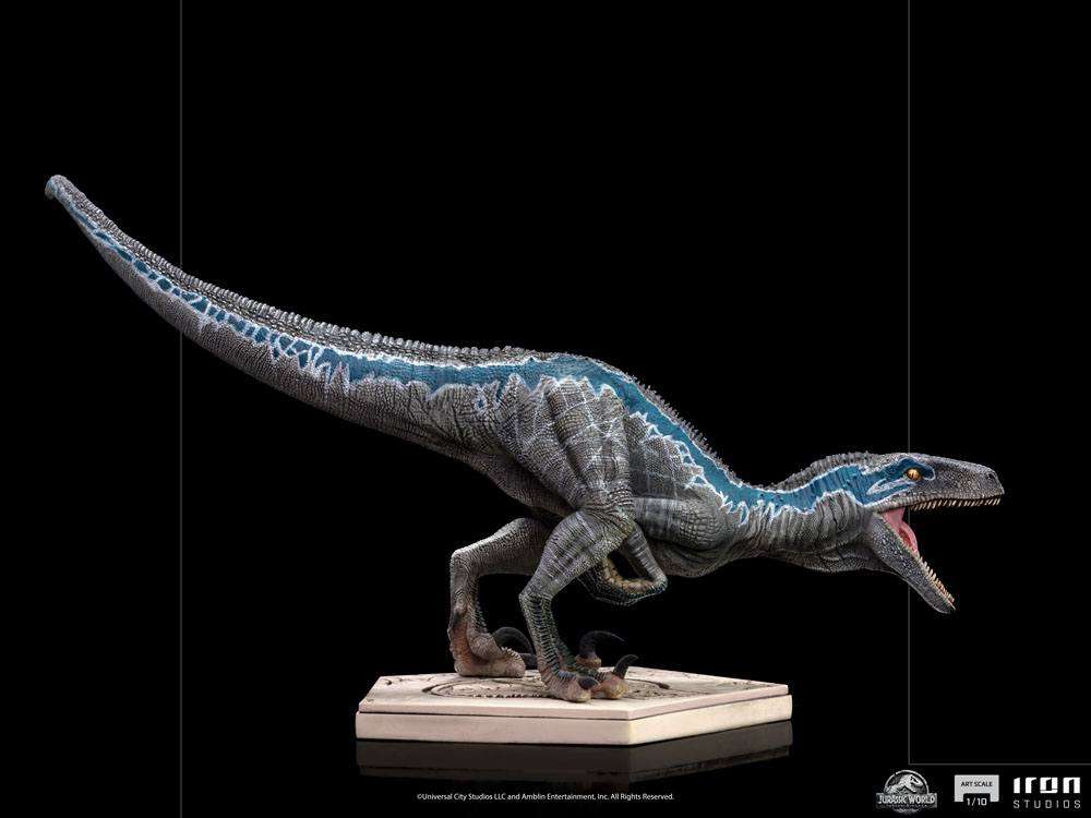Side view of the 19cm Iron Studios Blue statue from Jurassic World, featuring textured grey skin and a blue stripe.