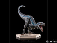 Side view of the 19 cm Iron Studios Jurassic World Blue 1/10 scale statue with detailed skin texture on a base.