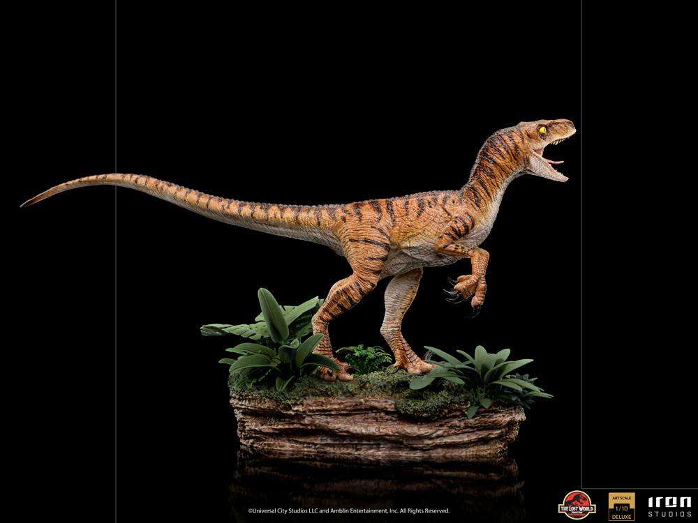 Side view of the Iron Studios 1/10 scale Velociraptor statue from The Lost World, featuring detailed tiger-striped skin.