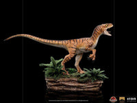 Side view of the Iron Studios 1/10 scale Velociraptor statue from The Lost World, featuring detailed tiger-striped skin.